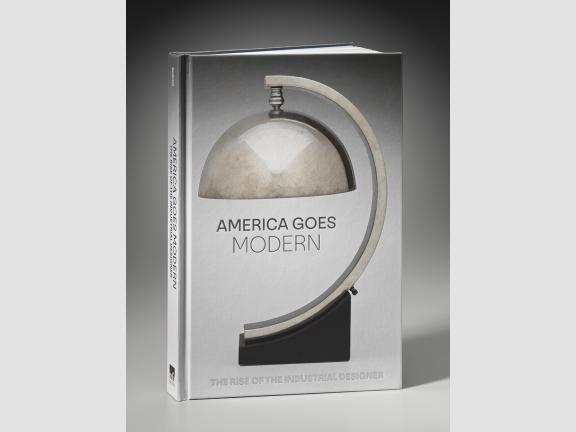 Cover of America Goes Modern, featuring silver art deco–style lamp