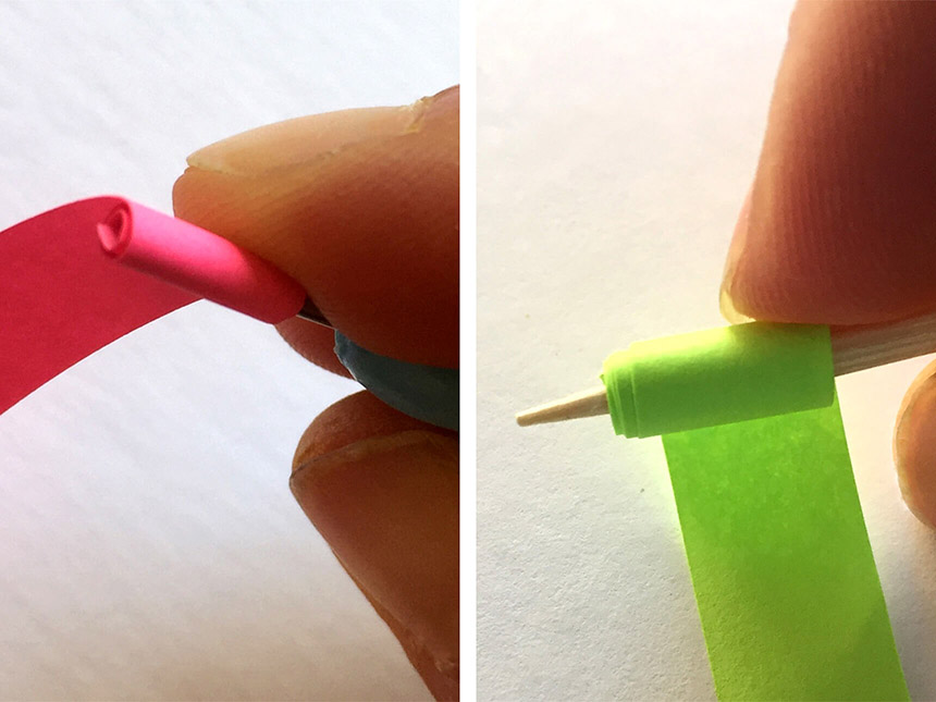 rolling strip of neon-colored paper around tip of quilling tool