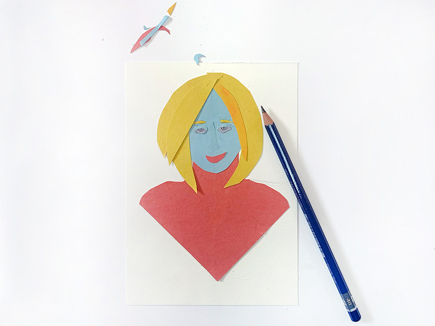 using colored pencil and marker to add details to head