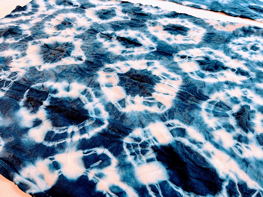 blue dye on white cloth in kumo pattern
