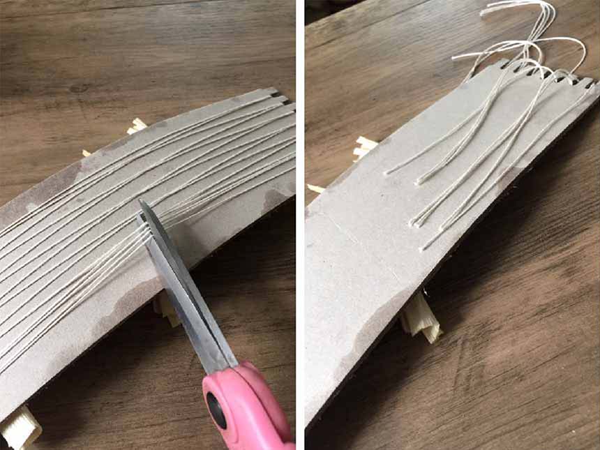 on opposite side of loom, using scissors to cut strings