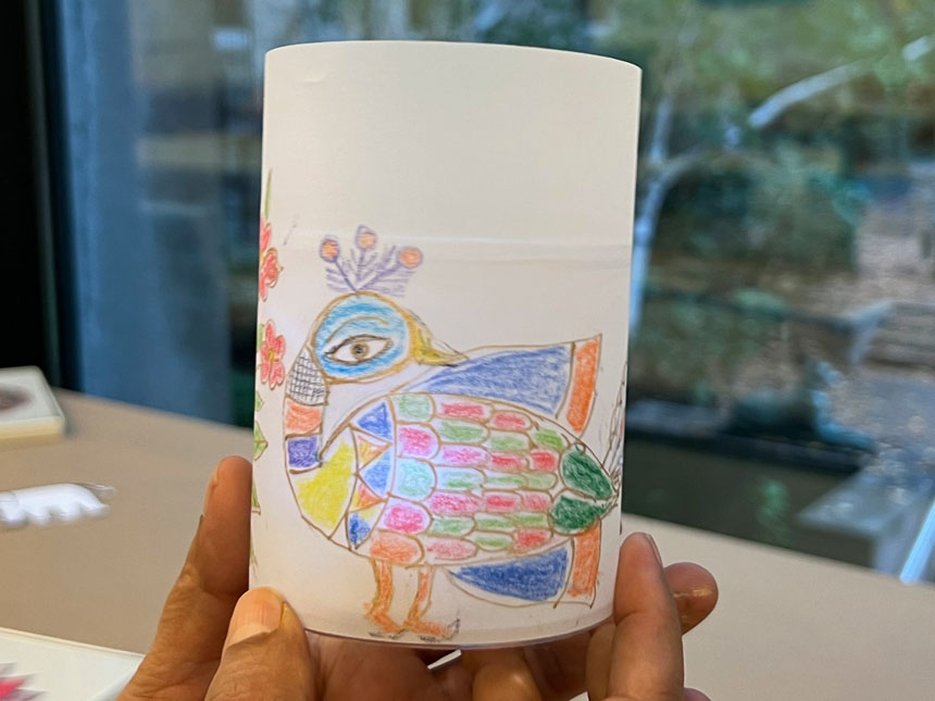 handmade paper lantern with drawing of peacock