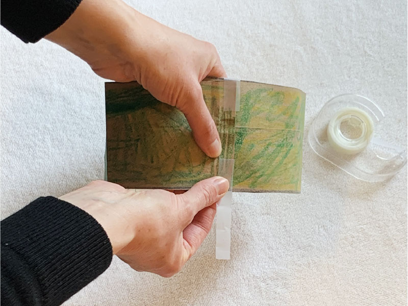 Using tape to attach ends of paper strip