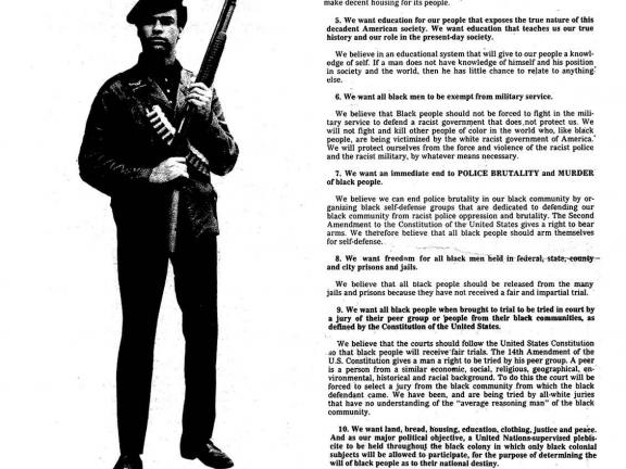 A newspaper spread featuring a man in a beret holding an automatic weapon on the lefthand column and text on the right side.