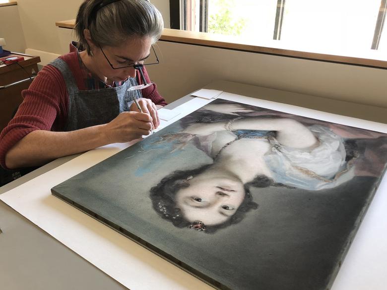 Conservator treating pastel on paper