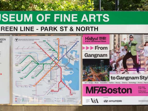 "Hallyu" ad next to MBTA subway map at Museum of Fine Arts stop