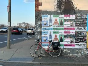 Numerous "Hallyu" posters plastered on side of building