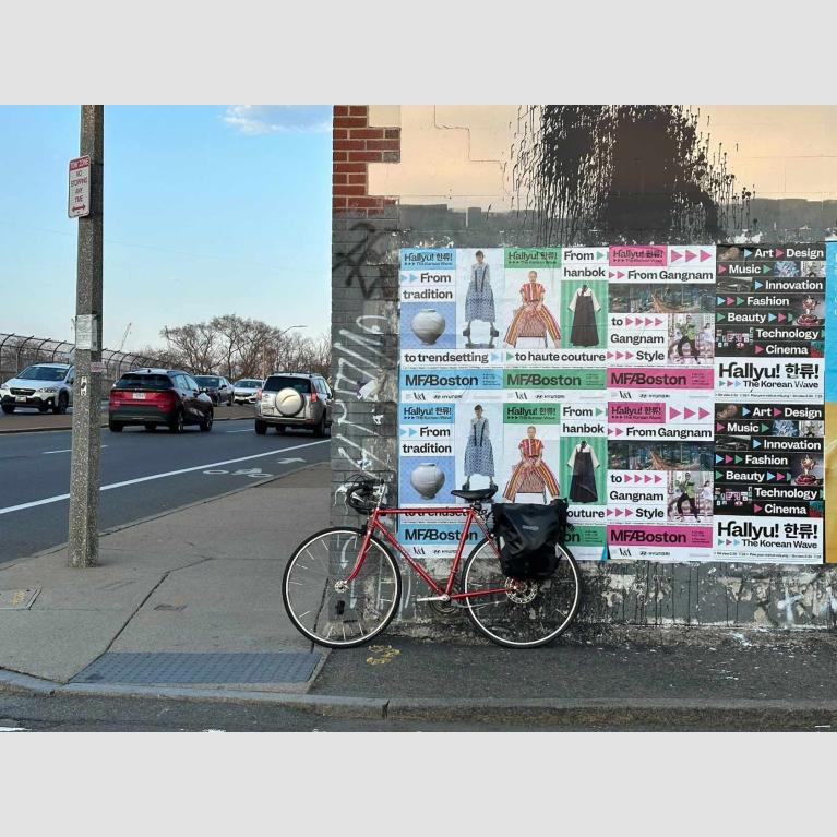 Numerous "Hallyu" posters plastered on side of building