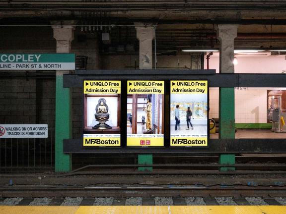 Triptych of three digital ads visible across trolley tracks at Copley station