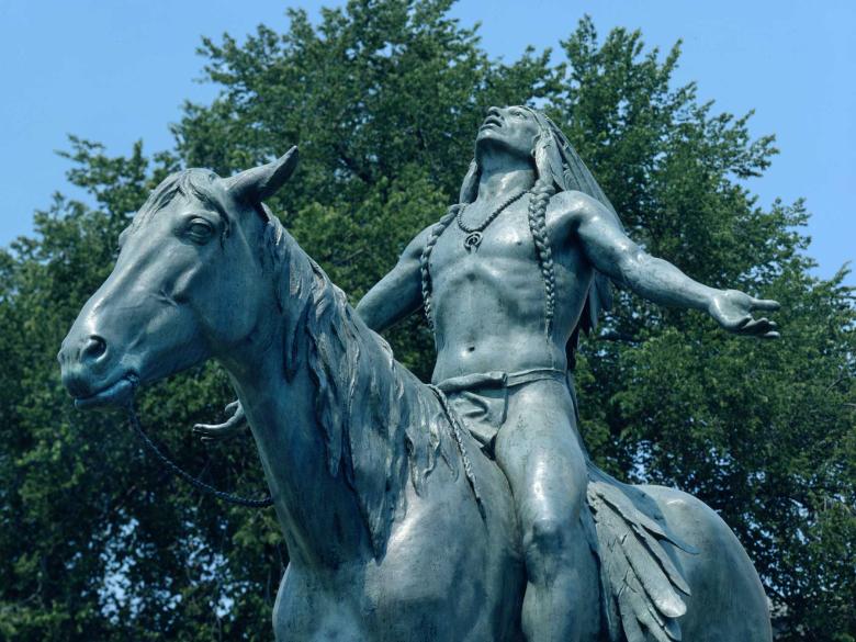 partial view of statue of a man on horseback.