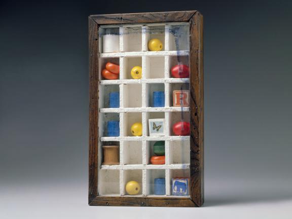 sculpture of a box with smaller trinkets inside