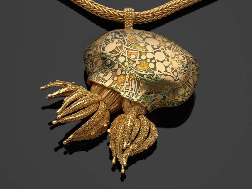 gold pendant in the shape of marine polyp colony