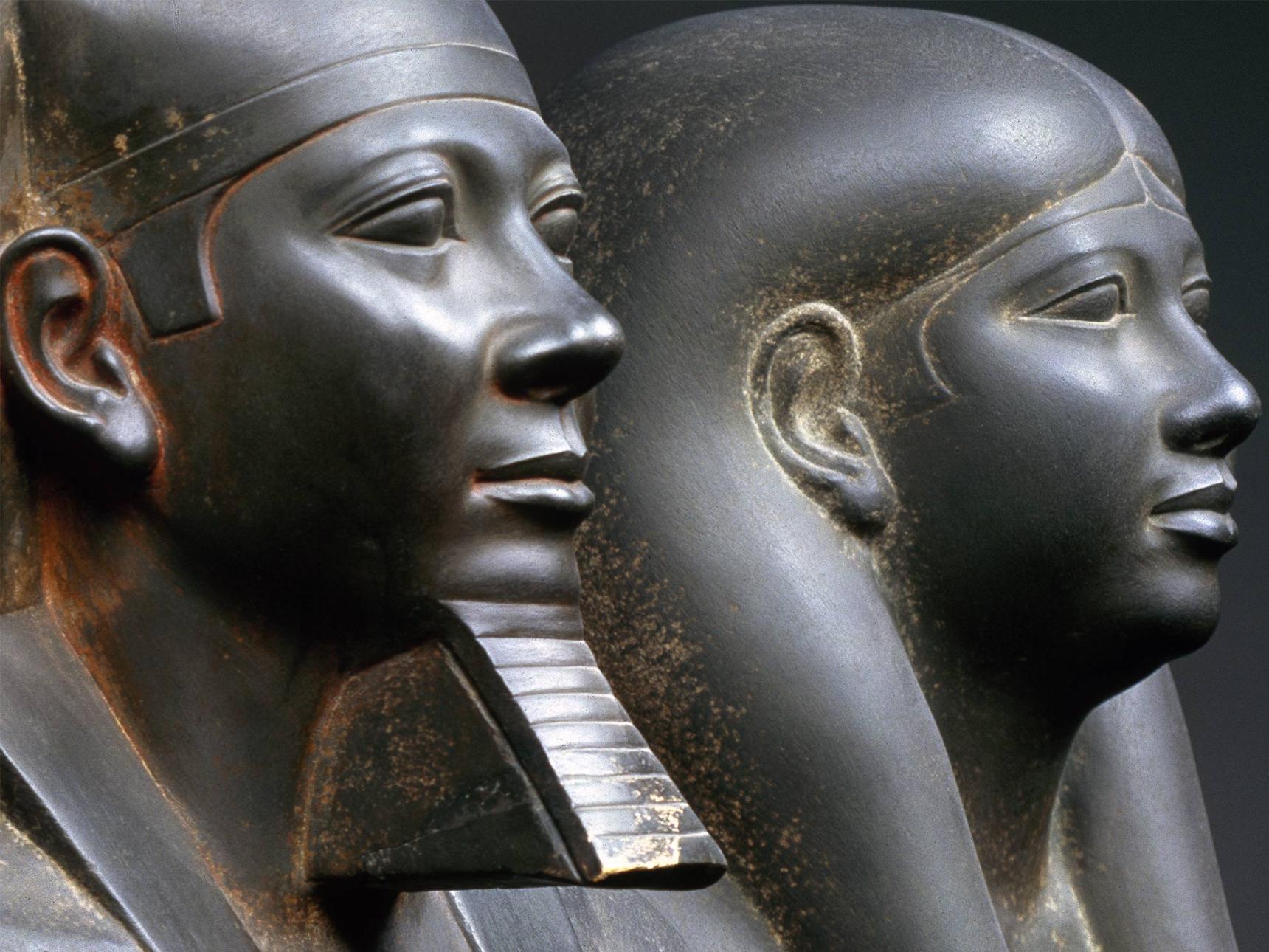 A detail of the sandstone statue of King Menkaura and Queen