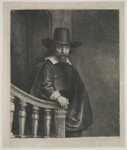 A bearded man wears a black hat and looks sternly at the viewer.