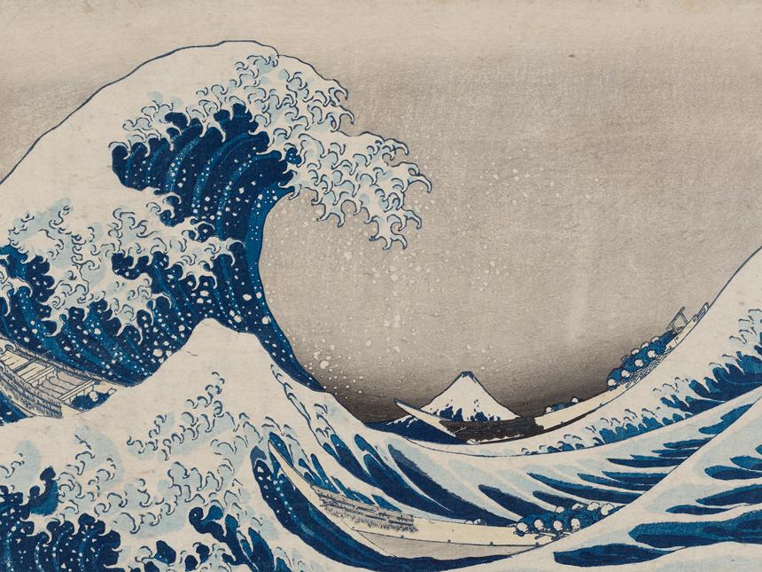 A woodblock print of a bright blue tidal wave cresting on choppy waters with a mountainscape in the distance.
