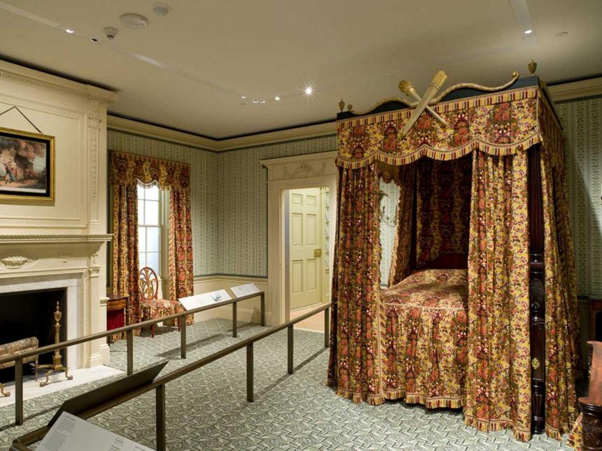 View of gallery for Oak Hill bedroom, with canopied bed to the right