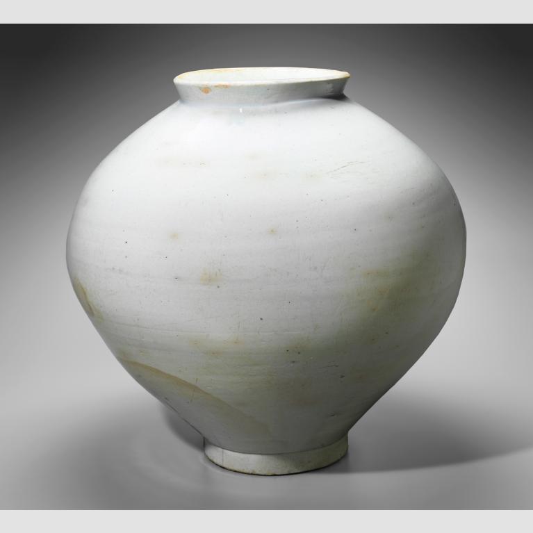 A rotund, white porcelain jar. 