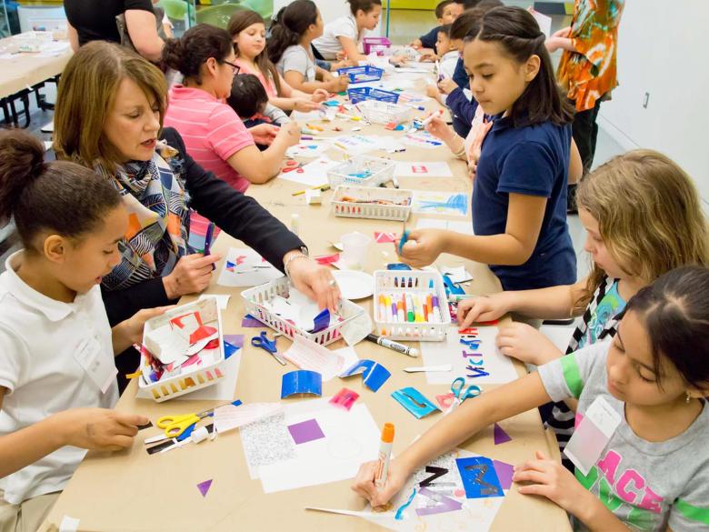Kids and adults participate in art-making activities in Druker. 