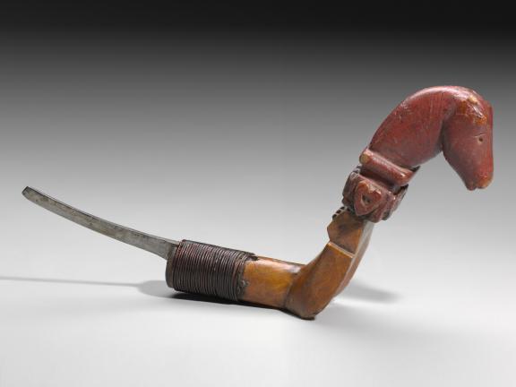 image of a knife with a carved horse head at the end