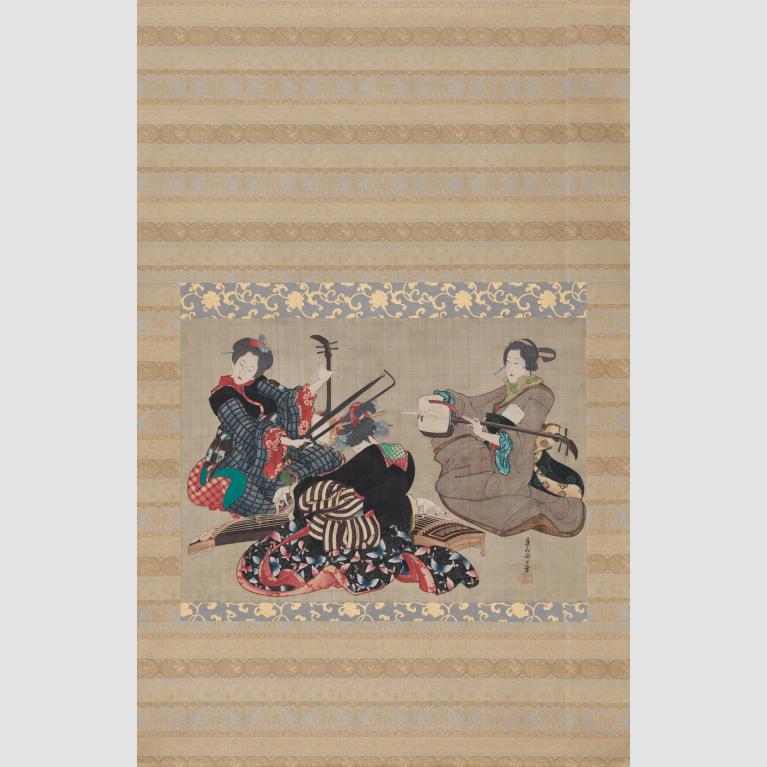 A hanging silk scroll depicting three women sitting and playing instruments. 