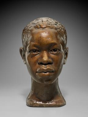 Plaster bust of a young Black man looking straight ahead with a reserved expression.
