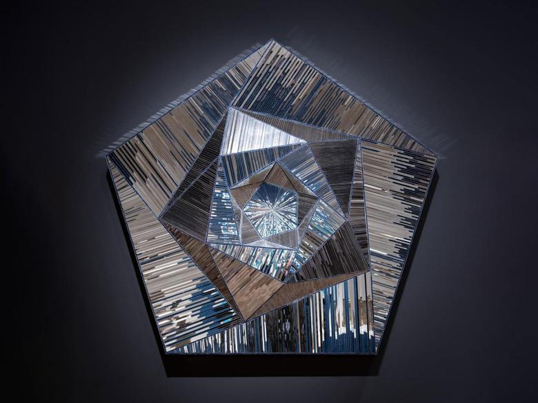 A metallic three-dimensional pentagon. 