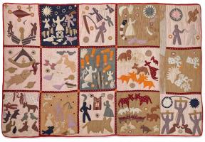 Quilt with different squares depicting human figures and animals
