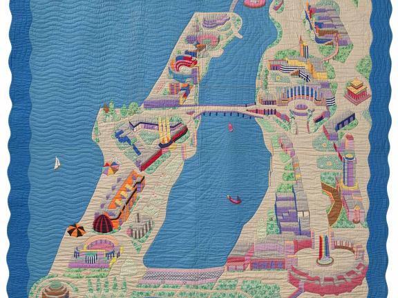 Multi colored quilt depicting a map and assorted objects