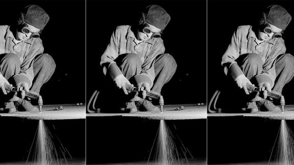 A black and white photograph of a women wearing goggles and welding; repeated three times.