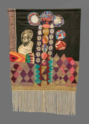 A hanging, mixed textile media, rectangular banner with tassels that depicts different shapes and figures. 