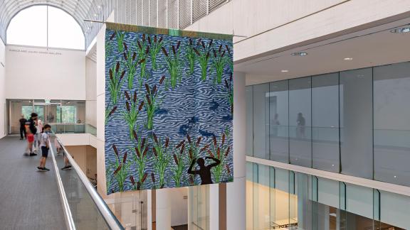 An installation photograph of Diedrick Brackens's hanging tapestry, visitation. 