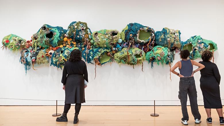 Visitors at the opening celebration of the Community Arts Initiative: From Farm to Craft Table exhibition.