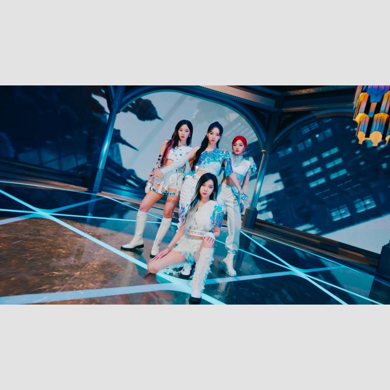 Members of female k-pop group, aespa pose in white and sparkly outfits for a promotional photo