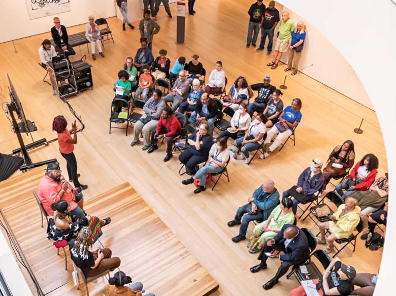 An overhead photo of a crowd of visitors listening to a City Talk during Juneteenth celebrations