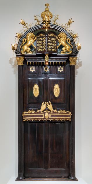 An ornate wood and gold Torah ark. 