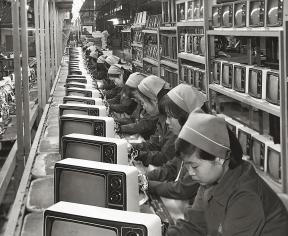 A group of women work on a television production line for Samsung. 