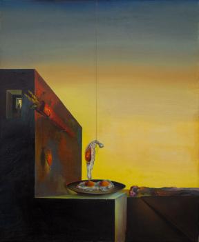 A building at sunset has a large carrot affixed to its side; two eggs on a plate sit on the building white one egg hangs above the plate from a string. 