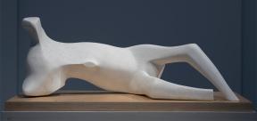 A marble bone-like statue resembling a reclining figure