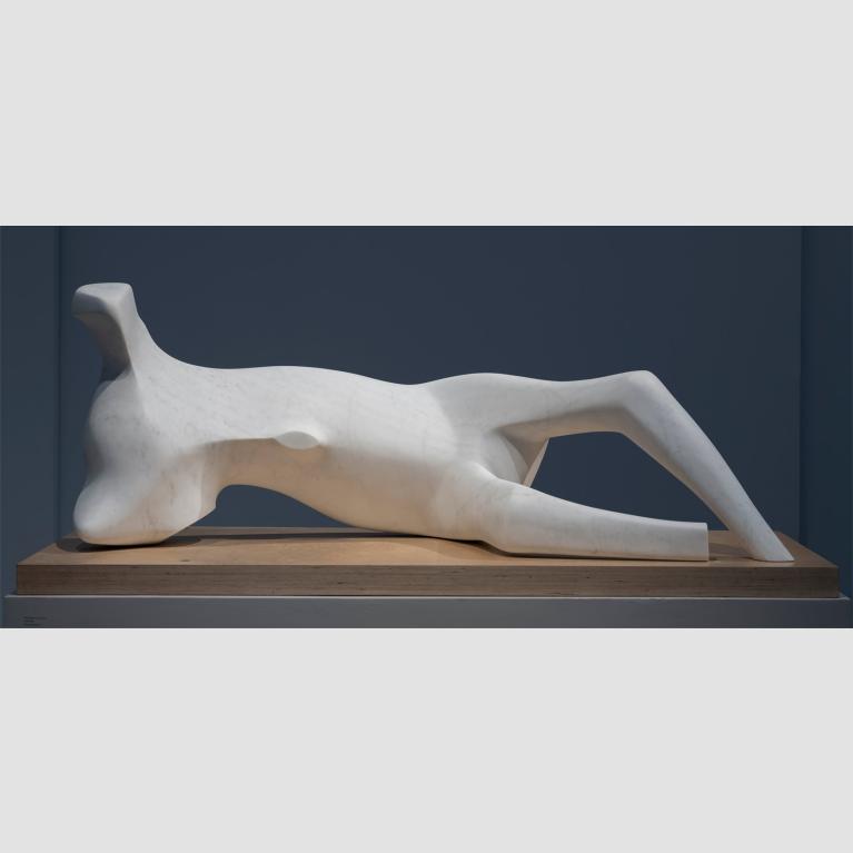 A marble bone-like statue resembling a reclining figure