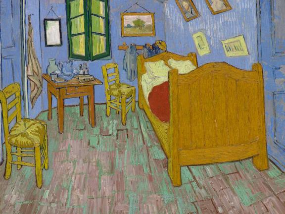 The painting depicts a minimalist styled room with a bed, two chairs a small table, and a washbasin 