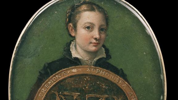 An oval painting on parchment, framed by silver, of the artist Sofonisba Anguissola holding a large shield.